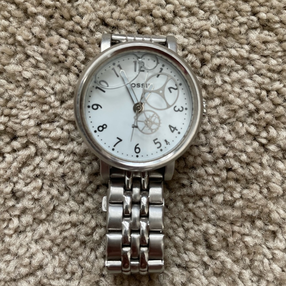 Fossil watch with floating nautical pendants